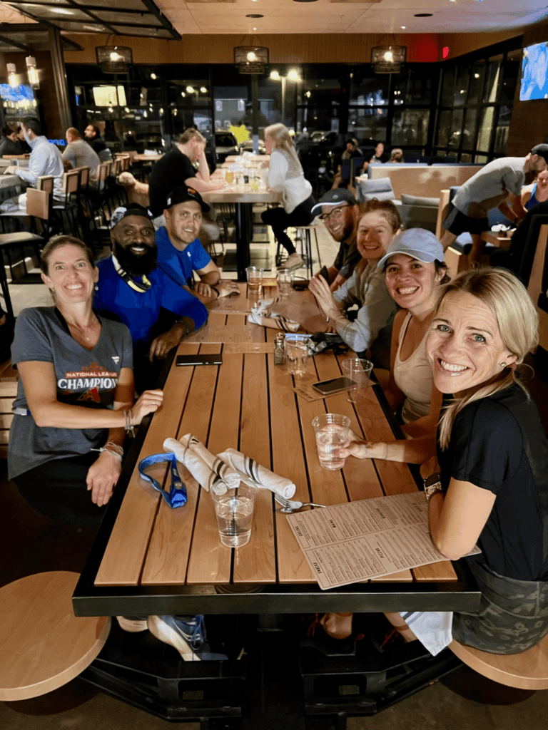 Friends enjoy dinner at a lively restaurant.
