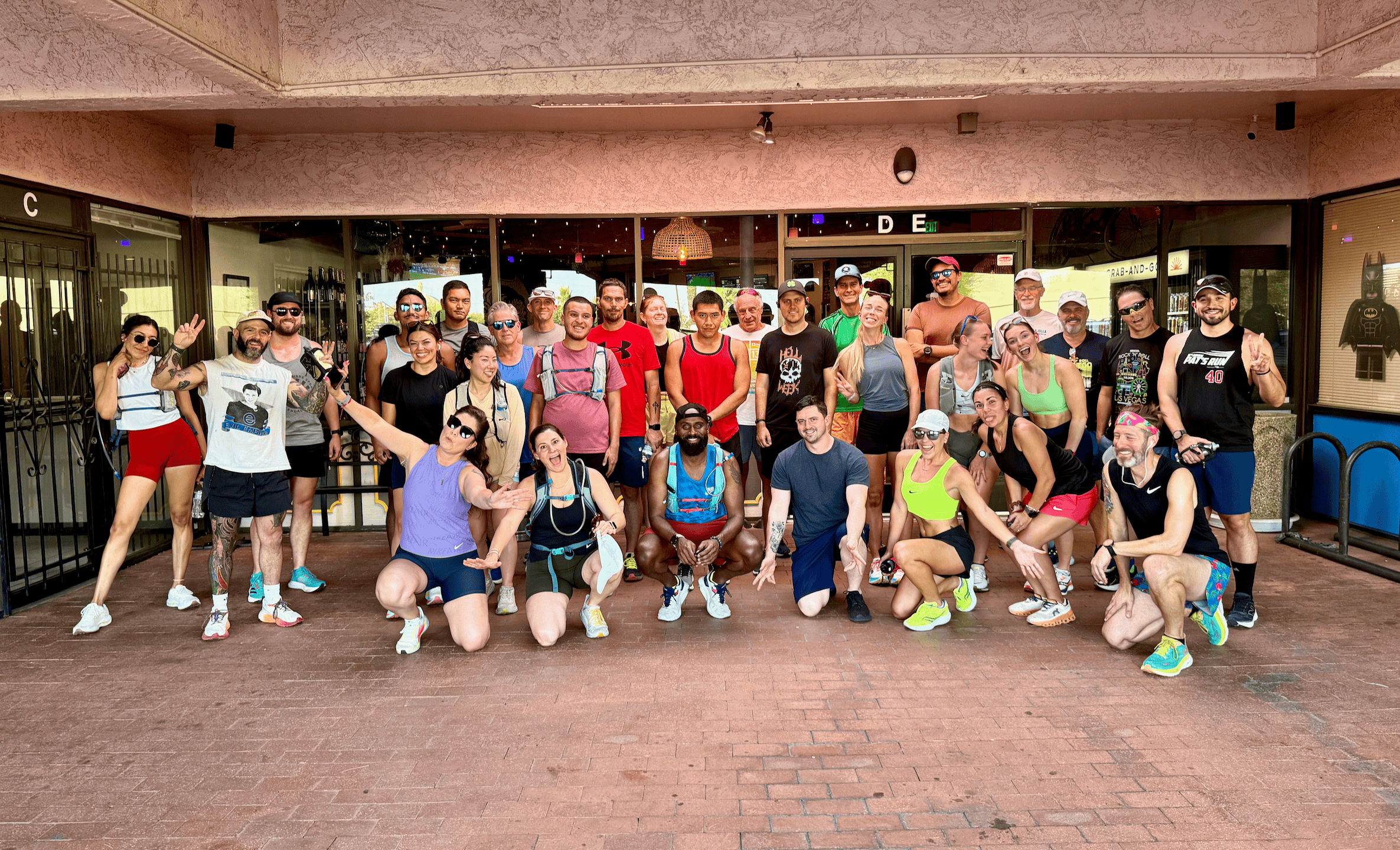 Group of people poses after a workout session.